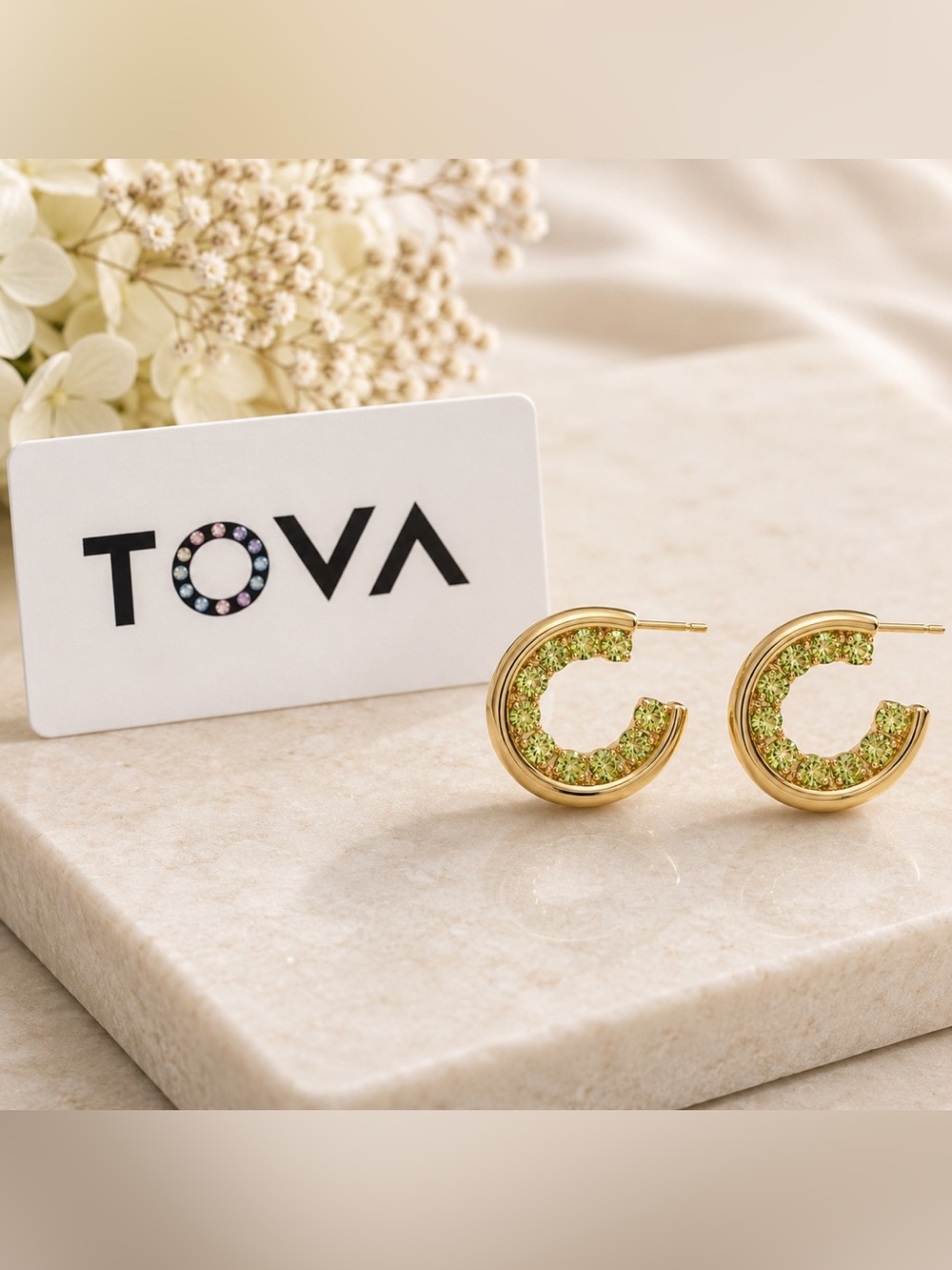 TOVA small everyday Gold Hoop Earrings with peridot green inside out crystals.